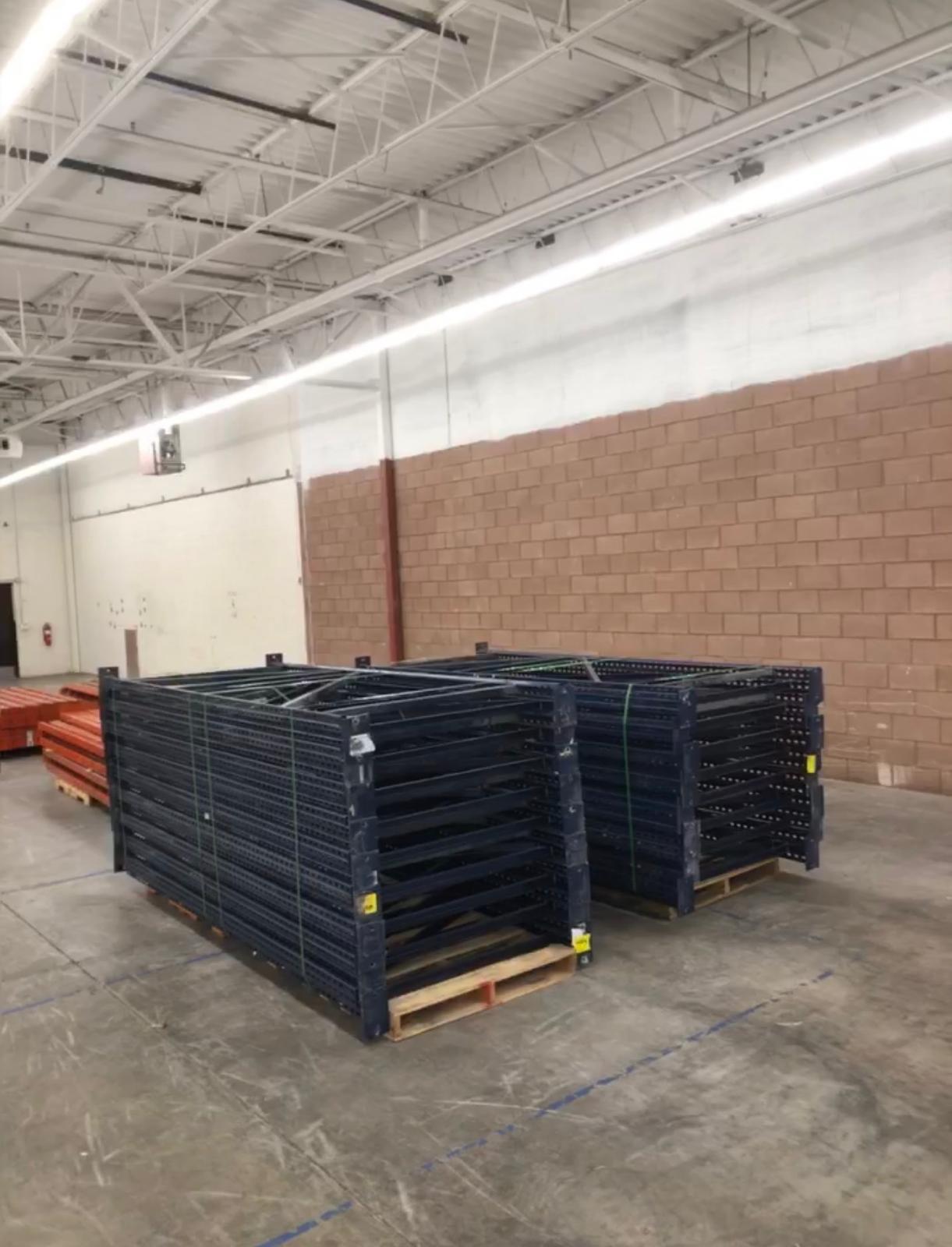 Bundled pallet racking systematically dismantled